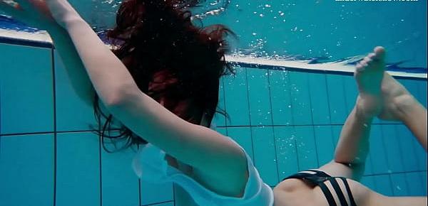  Alla Birtakik undresses nude in the swimming pool